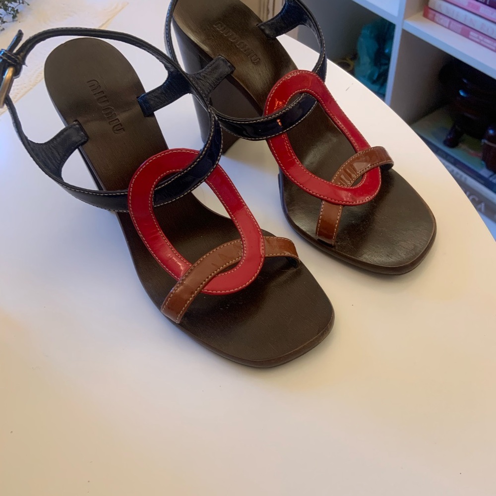 Miu Miu navy, red, brown patent 4 1/4” heels.
